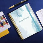 Daily Planner Undated - B5 To Do List Notebook Hourly Schedules, Spiral Appointment Planner for Women and Men, PVC Hardcover, Inner Pocket, Elastic Closure, 7" x 10", Blue Watercolor