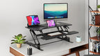 Mount-It! 38" Standing Desk Converter, Desktop Sit-Stand Desk Riser with Gas Spring Height Adjustment, Compact Desk Topper for Dual Monitors or Laptop, Keyboard Tray, Black